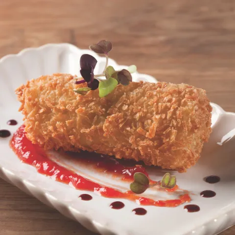 Canelón crujiente de pollo Pota Blava con chutney de tomate, trufa y reducción de Oporto