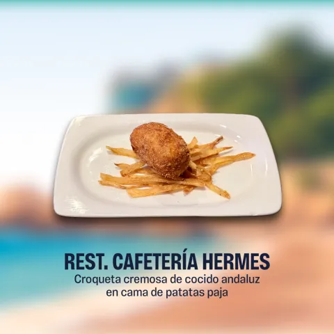 Croqueta cremosa de cocido andaluz en cama de patatas paja